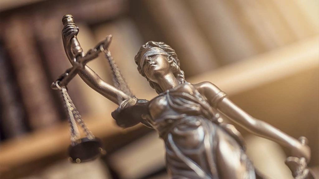 justice figurine holding a scale