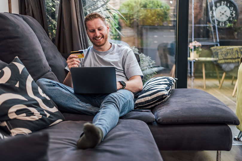 happy man looking at computer