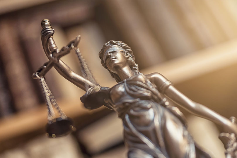 justice figurine holding a scale